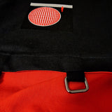 Interior view showing bright red lining, magnetic snap closure, and inner pocket detail