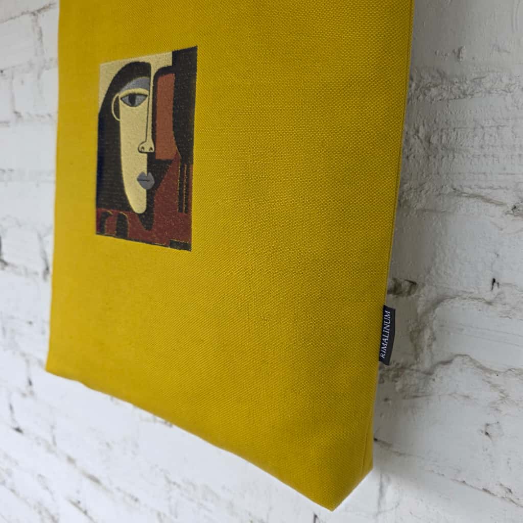 Embroidery detail close-up on yellow canvas