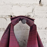 Knotted strap detail of burgundy plaid cotton tote