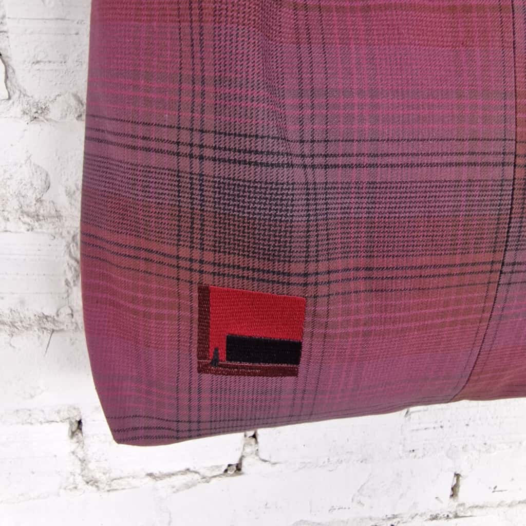 Close-up of burgundy plaid fabric tote bag with decorative red stitched detail – handmade cotton hobo purse