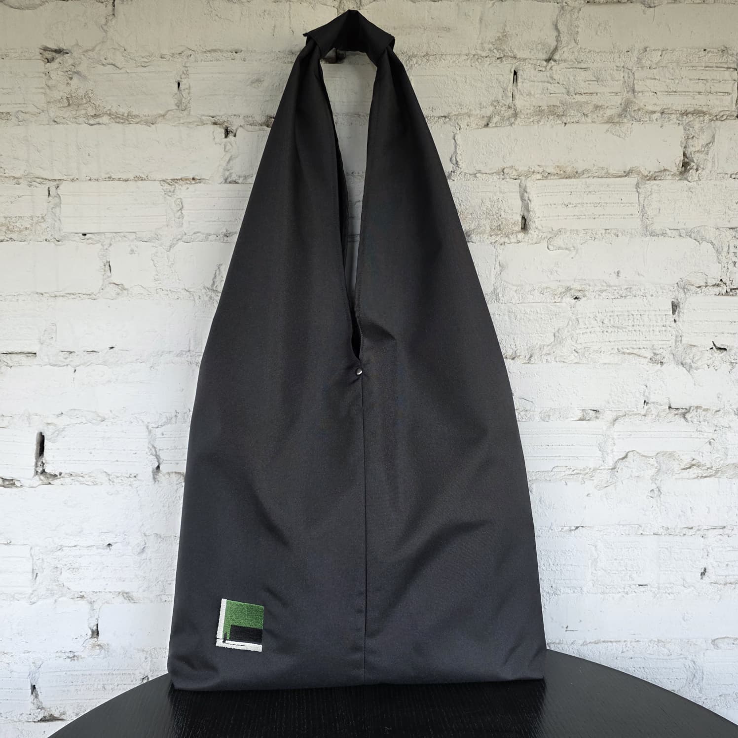 Minimalist black HOBO bag “The Path Finder” front view — handmade water-resistant tote