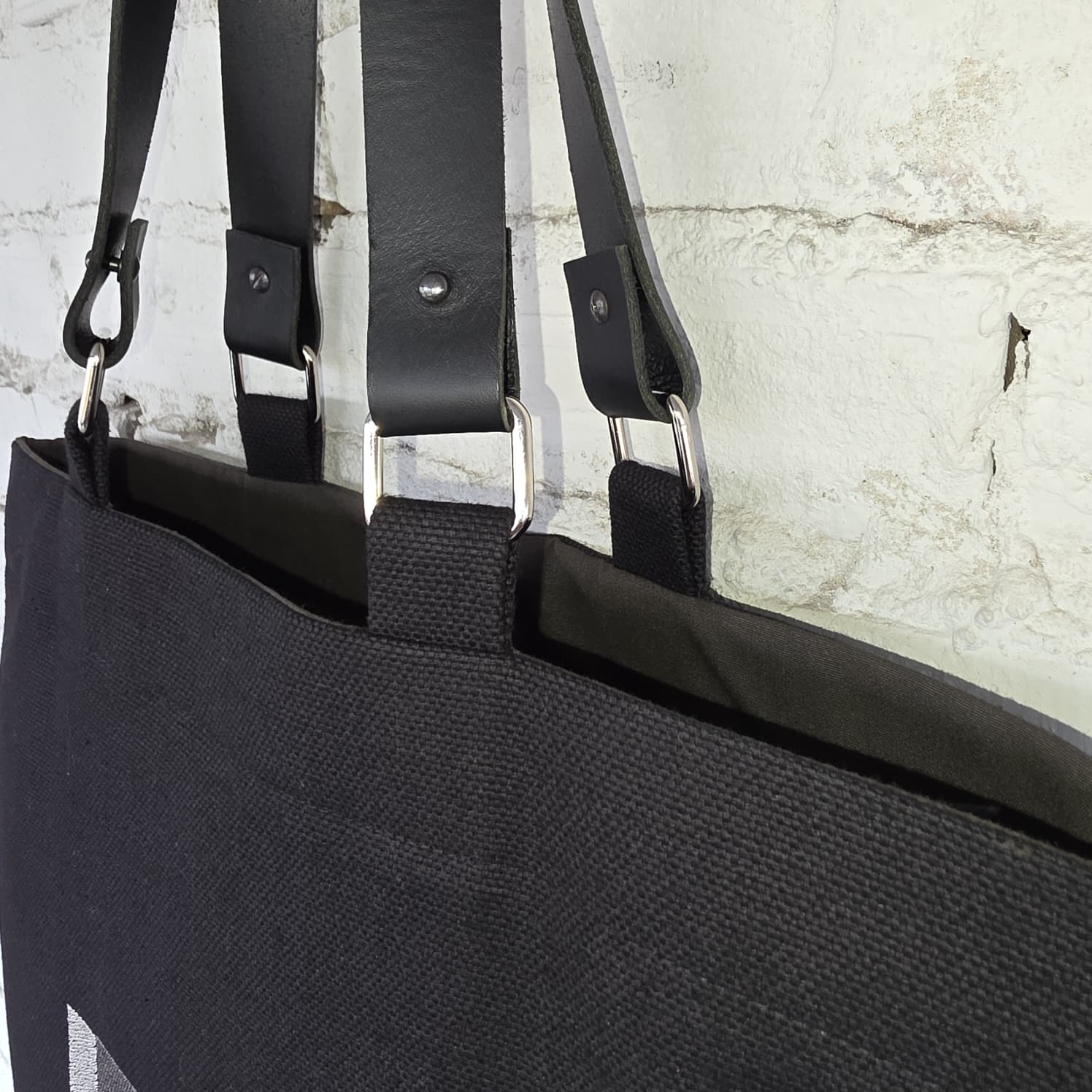 Black tote bag with genuine leather straps and khaki lining 