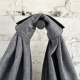 Close-up of knotted handle on gray hobo bag showing durable waterproof fabric texture