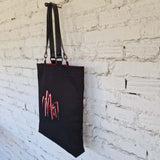 Handmade black linen-cotton tote bag with leather handles and embroidered design inspired by Kazys Varnelis “Chairs.”