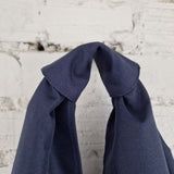 Top knot handle detail of handmade blue hobo bag, minimalist waterproof tote design