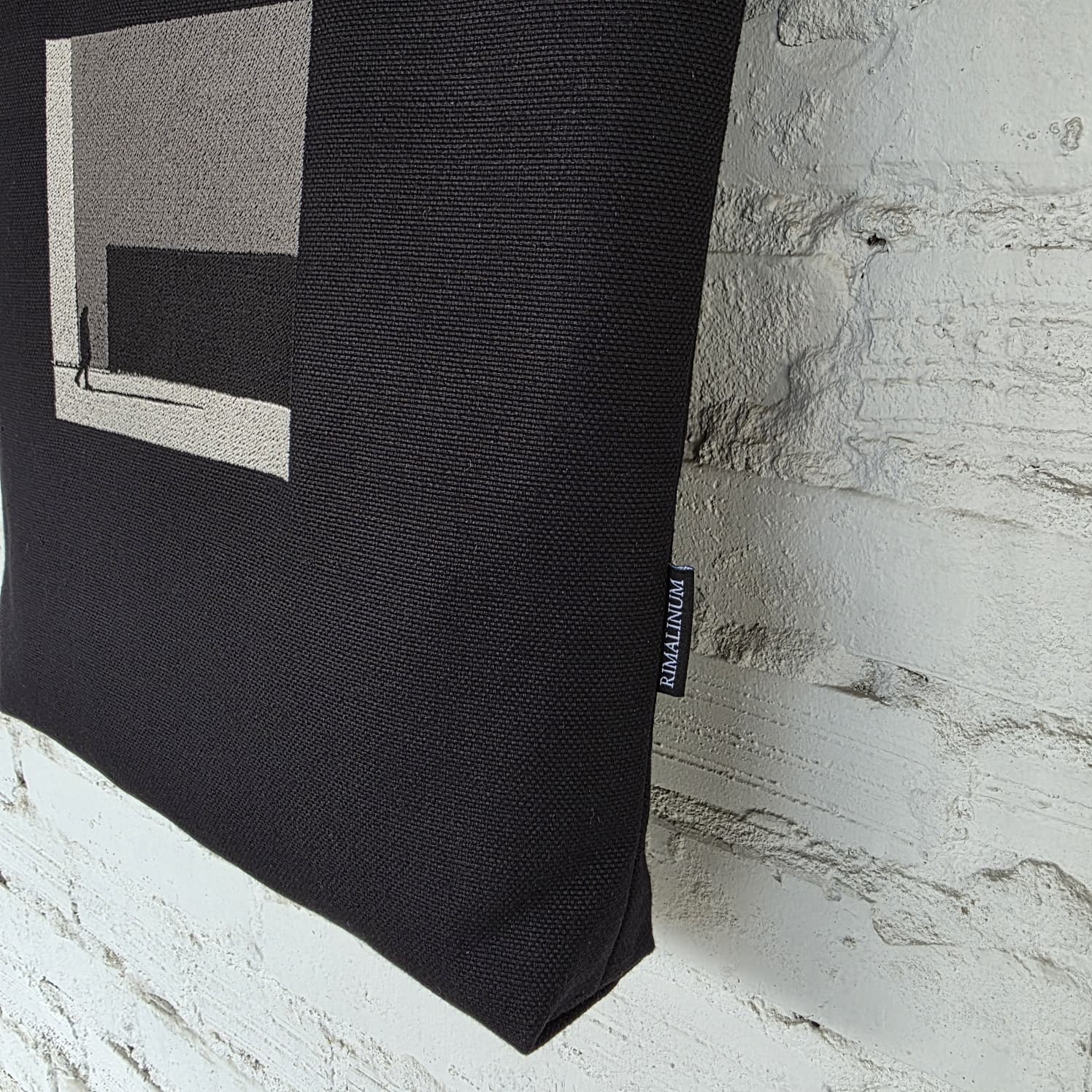 Minimalist handmade black tote bag made of linen and cotton with The Path Finder embroidery