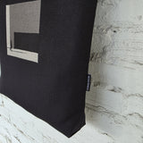 Minimalist handmade black tote bag made of linen and cotton with The Path Finder embroidery