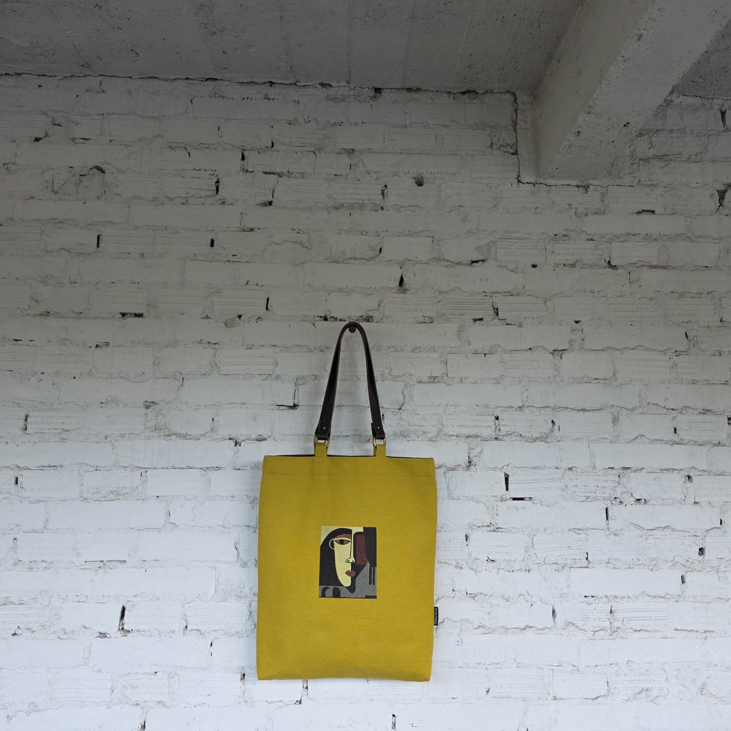 Full view of mustard tote with detachable leather handles