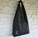 Side view of The Path Finder black HOBO bag — modern urban minimalist design