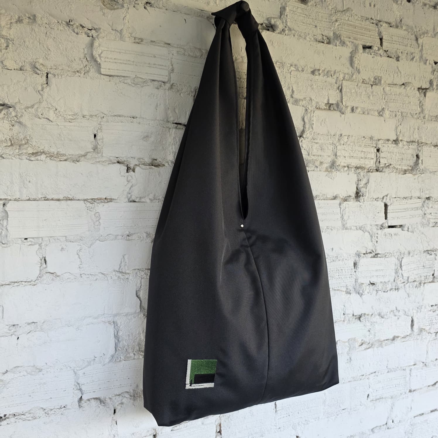 Side view of The Path Finder black HOBO bag — modern urban minimalist design
