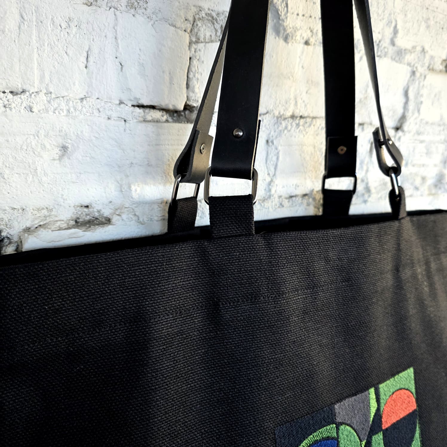 Detachable genuine leather handles on handmade black tote bag