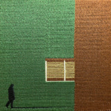 Detailed embroidery on brown canvas tote featuring minimalist green geometric architectural art design