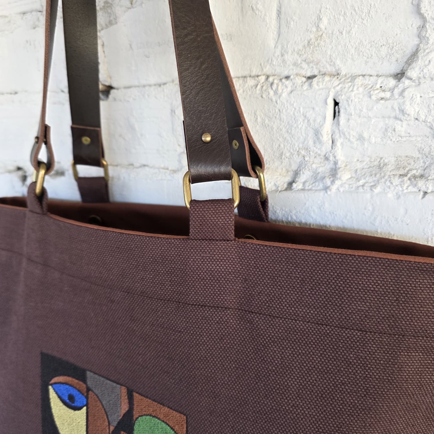 Genuine leather handles detail on linen cotton tote bag
