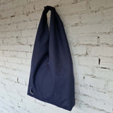Side view of handmade navy hobo bag, eco-friendly fabric, simple waterproof shoulder tote