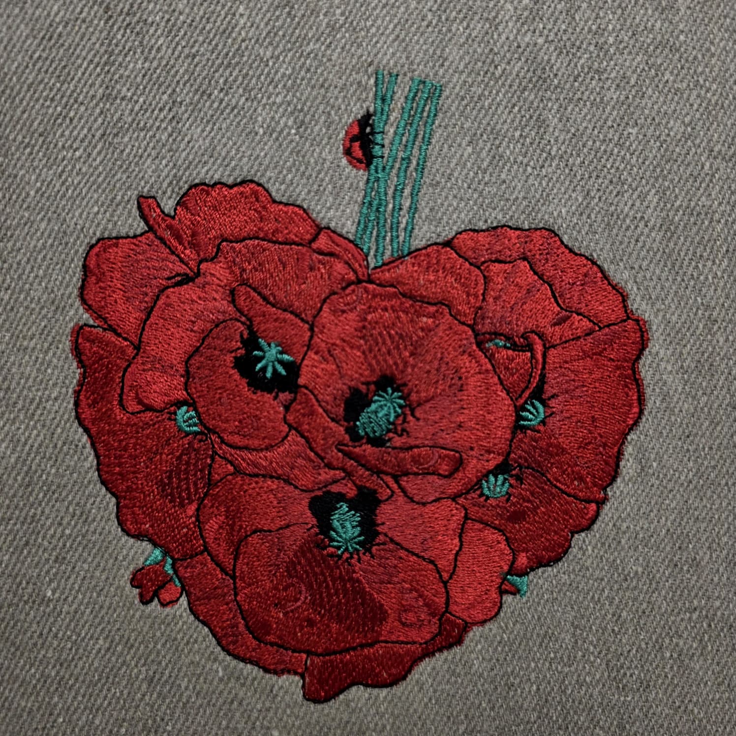 Embroidered poppy heart design