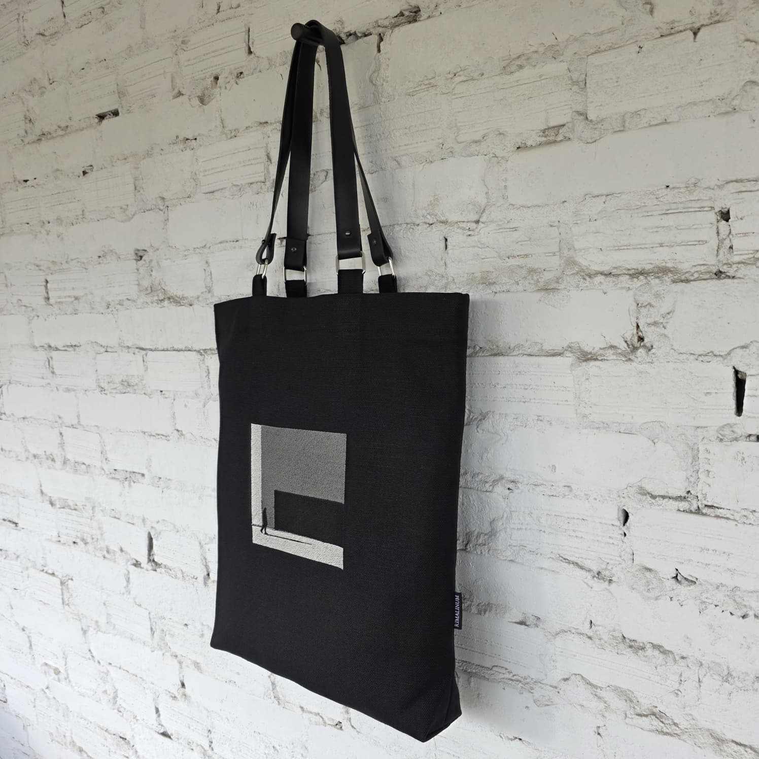 Black linen and cotton tote bag with khaki embroidered The Path Finder design