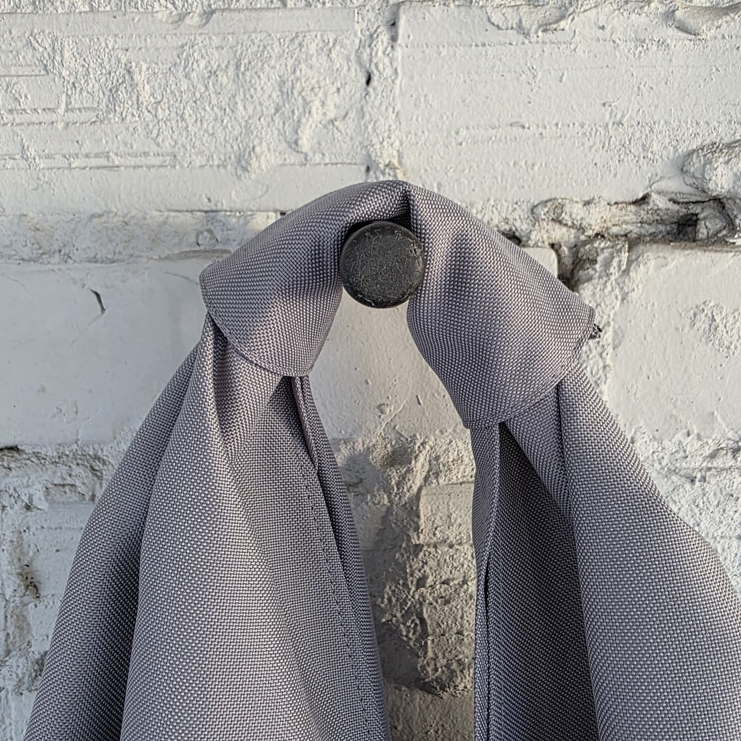 Handle detail of light grey unisex hobo bag – durable waterproof fabric texture