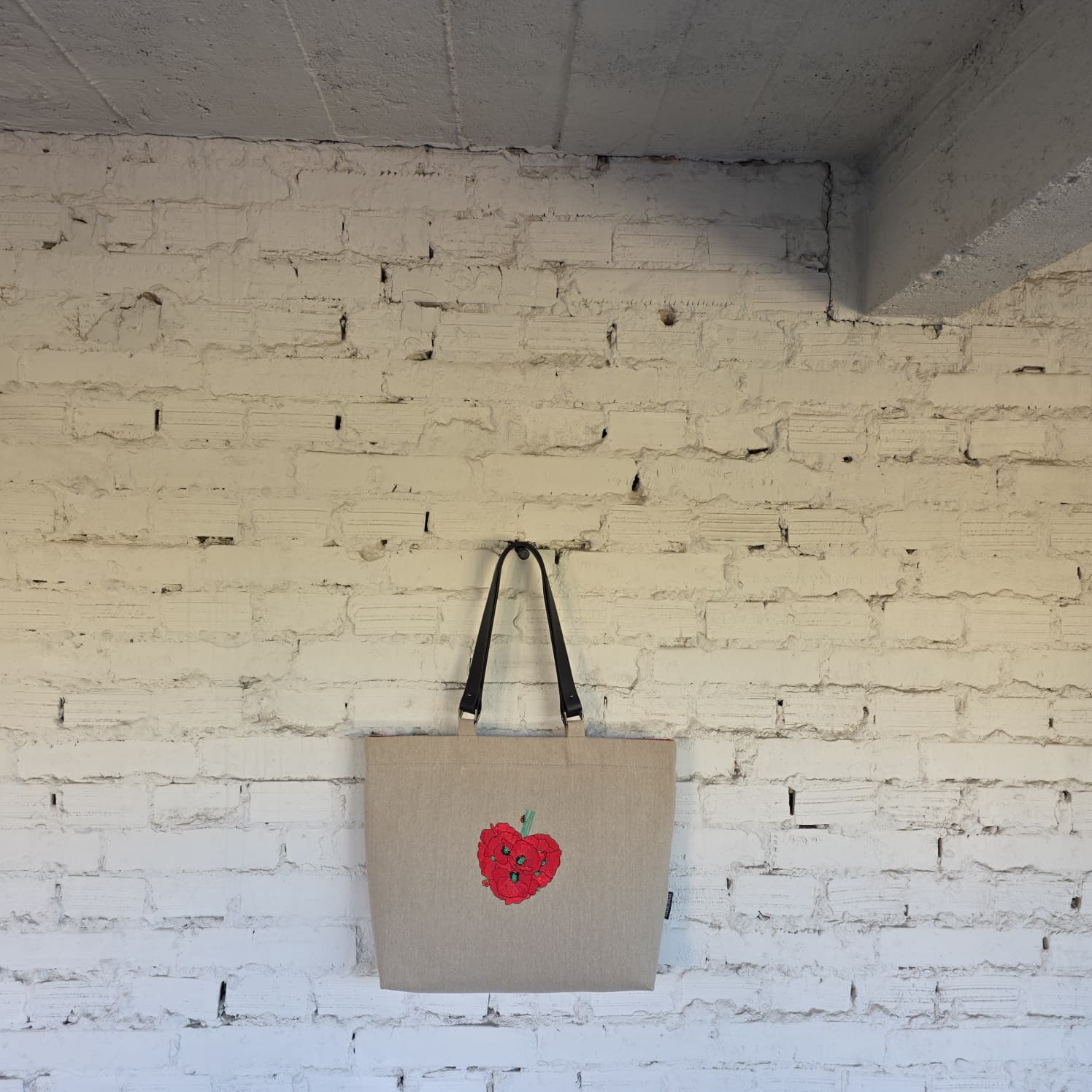 Large handmade linen tote bag with natural linen fabric, leather handles, and artisan craftsmanship