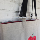 Handmade linen tote bag with embroidered poppy heart and premium leather handles