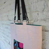 Pink tote bag with detachable leather handles and magnetic clasp