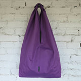 Back view of the purple Hobo bag. The RIMALINUM logo and pocket seams are visible.