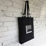 Elegant black tote bag featuring modern architectural embroidered design The Path Finder